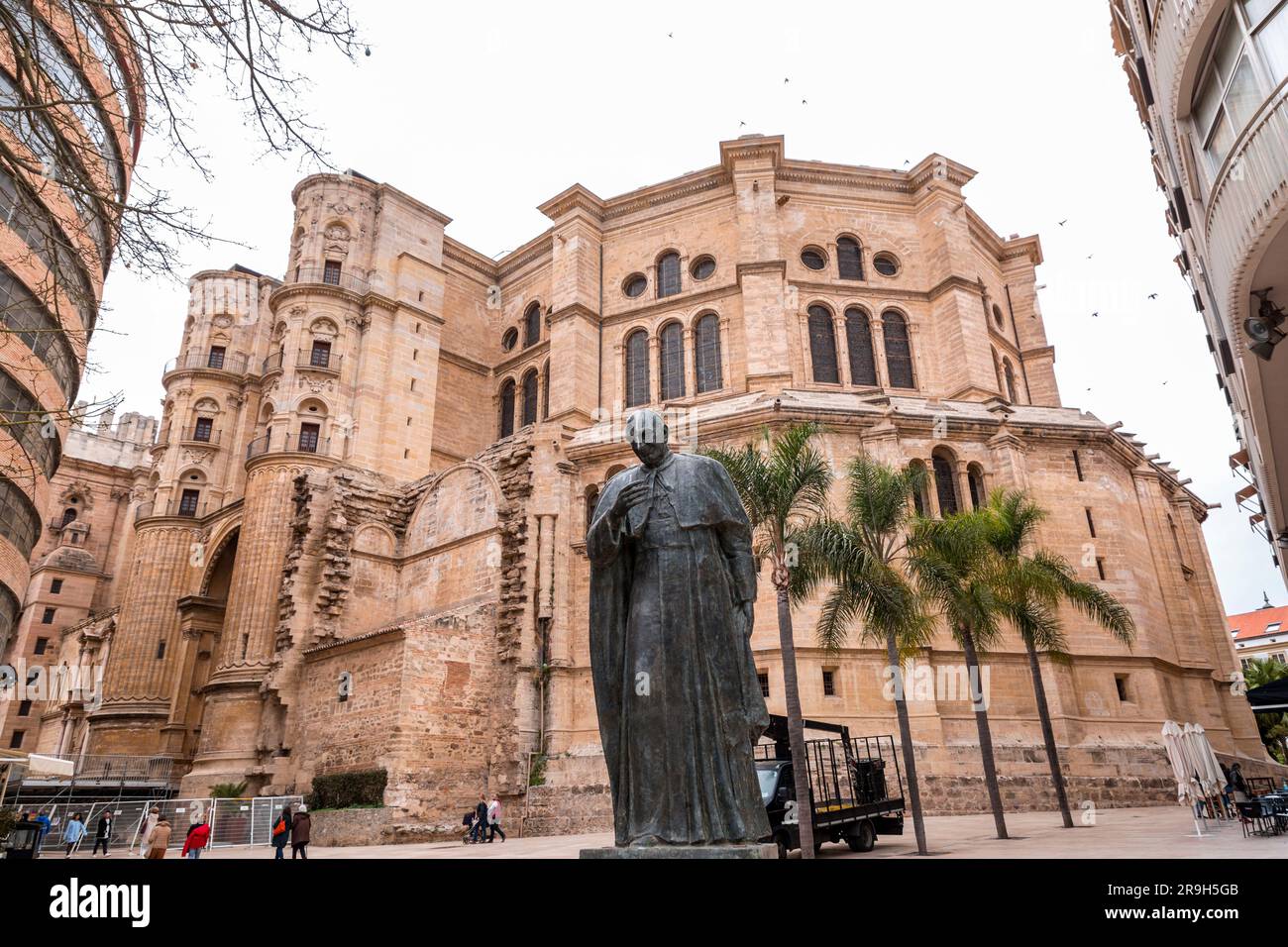 Malaga, Spain - FEB 27, 2022: Statue of Cardinal Herrera Oria at the rear facade of the Malaga Cathedral, Malaga, Spain. Stock Photo