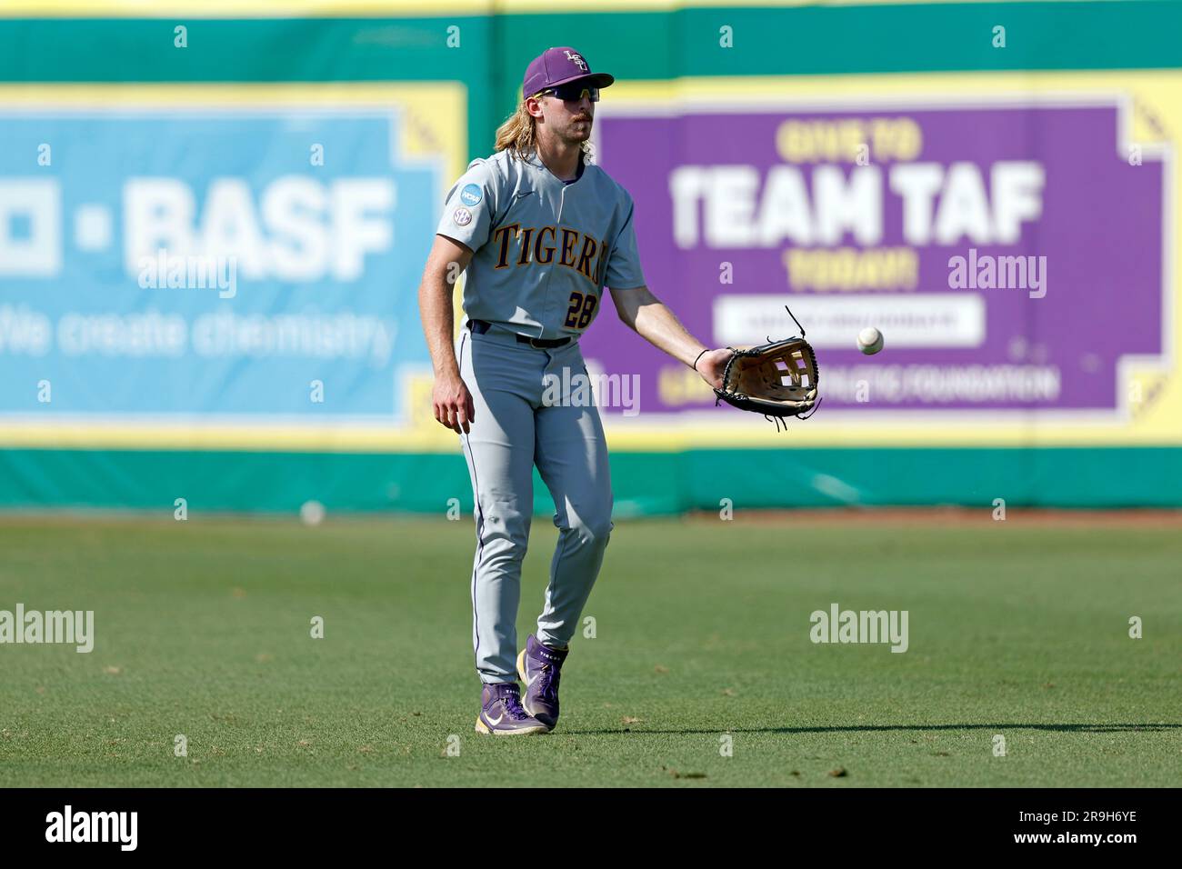 LSU outfielder Paxton Kling (28) warms up before an NCAA college