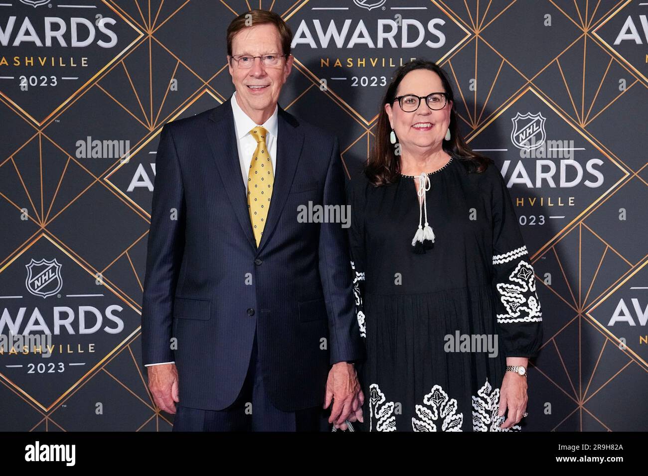 Nashville Predators retiring hockey general manager David Poile, left, and  his wife Elizabeth Poile, right, pose on the red carpet before the NHL  Awards, Monday, June 26, 2023, in Nashville, Tenn. (AP