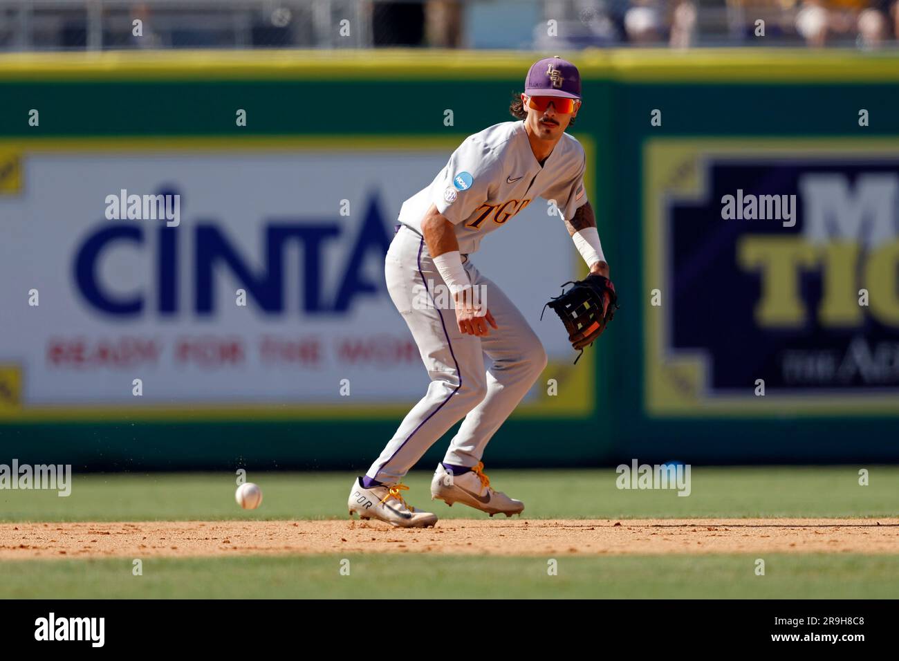 LSU infielder Jordan Thompson (4) warms up before an NCAA college baseball tournament super