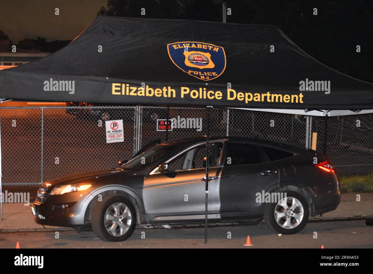 authorities-put-down-cones-to-mark-where-the-bullets-are-at-the-crime