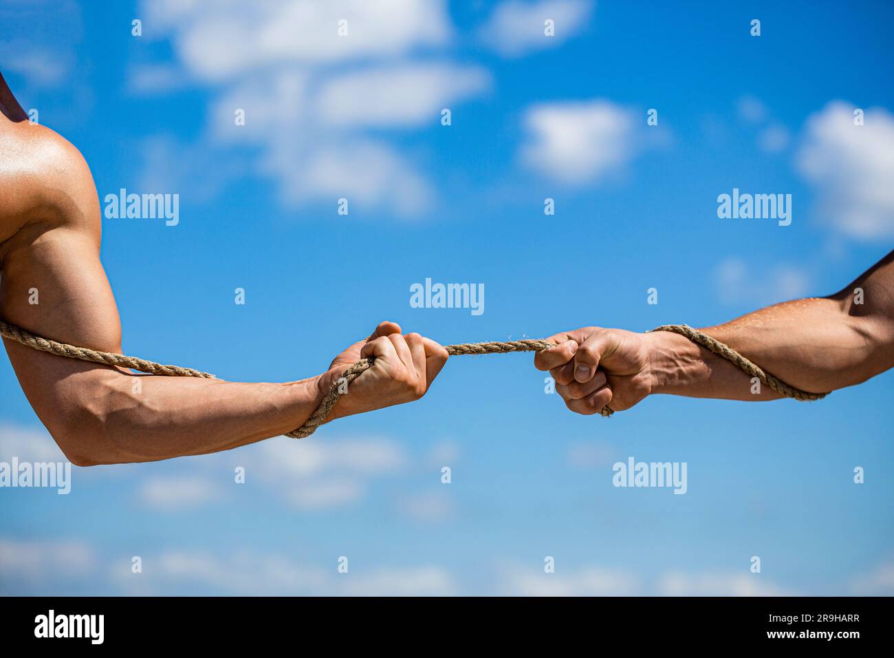 Rope, cord. Hand holding a rope, climbing rope, strength and