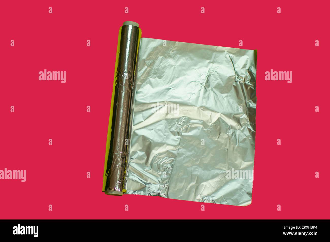 aluminum foil on viva magenta background , kitchen tools and utensils
