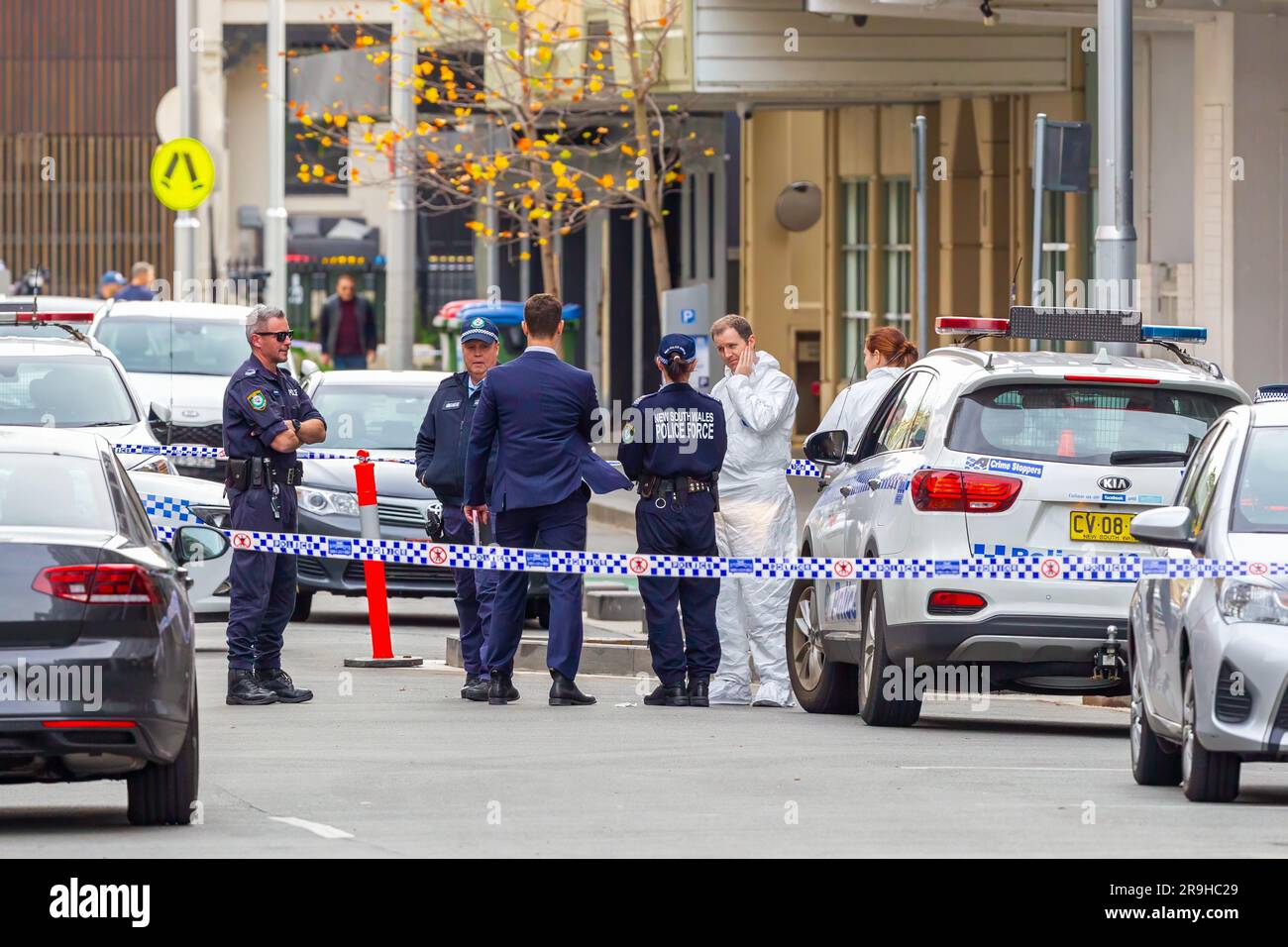 Sydney, Australia. 27 Jun 2023. Alen Moradian, an alleged underworld figure with suspected links to outlaw motorcycle gangs, has been shot and killed in his car. The deadly shooting occurred in the basement car park of Moradian's residence in Spring Street, Bondi Junction. He was sitting in his luxury automobile at the time of his death. Police are treating the crime as a targeted assassination. Pictured: police on Spring Street, cordoned off while investigations continue. Credit: Robert Wallace / Wallace Media Network / Alamy Live News Stock Photo
