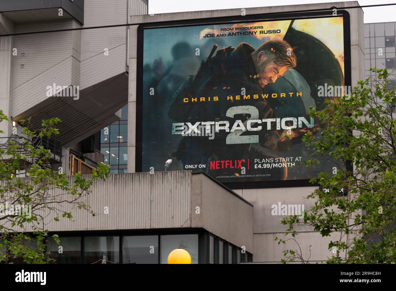 Display advert for Extraction 2 with image of Chris Hemsworth. Piccadilly Gardens, Manchester UK Stock Photo