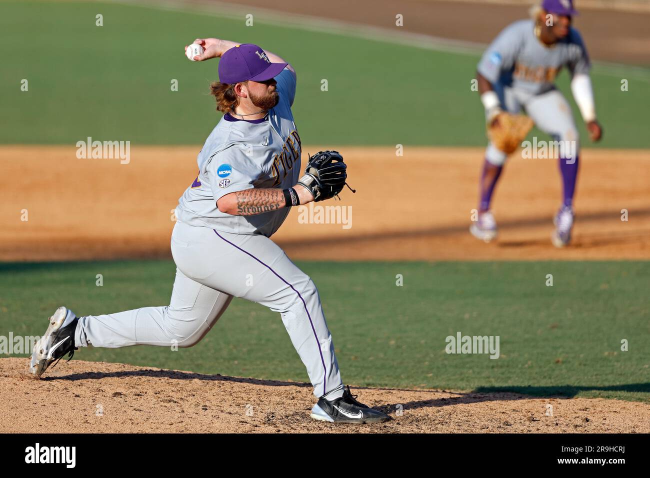 LSU pitcher Riley Cooper (38) throws during an NCAA college baseball tournament super regional