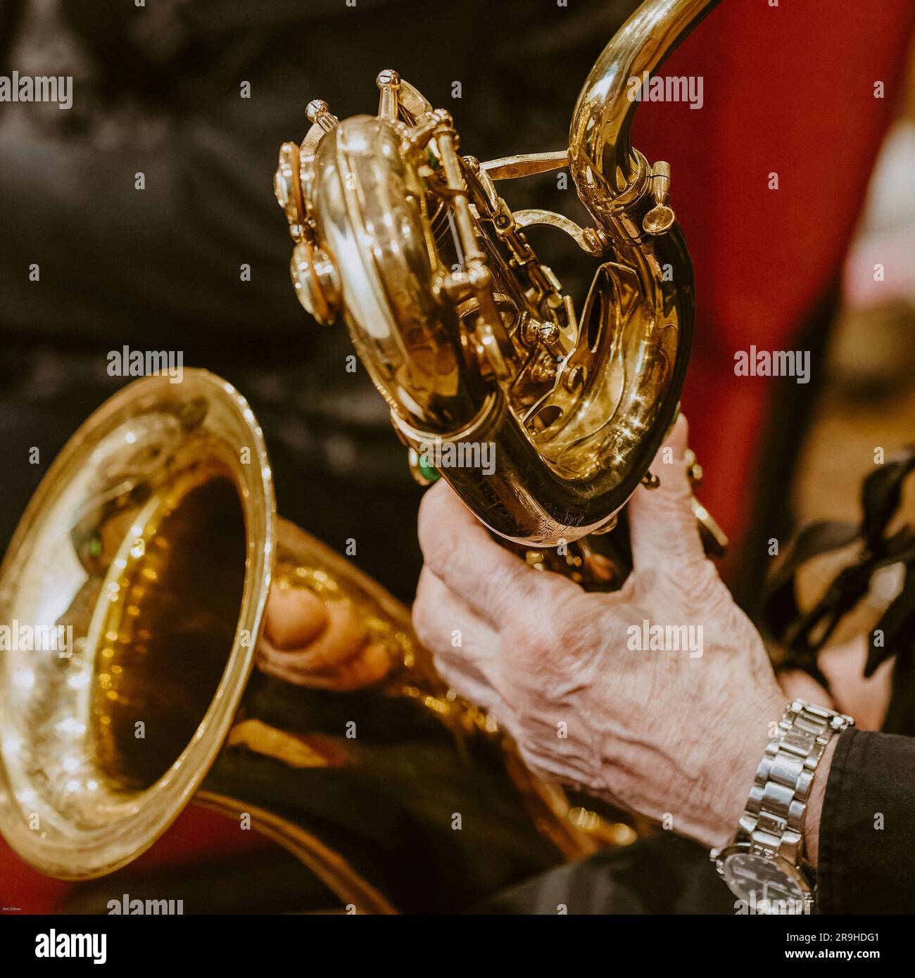 A closeup of a man playing the saxophone. Stock Photo