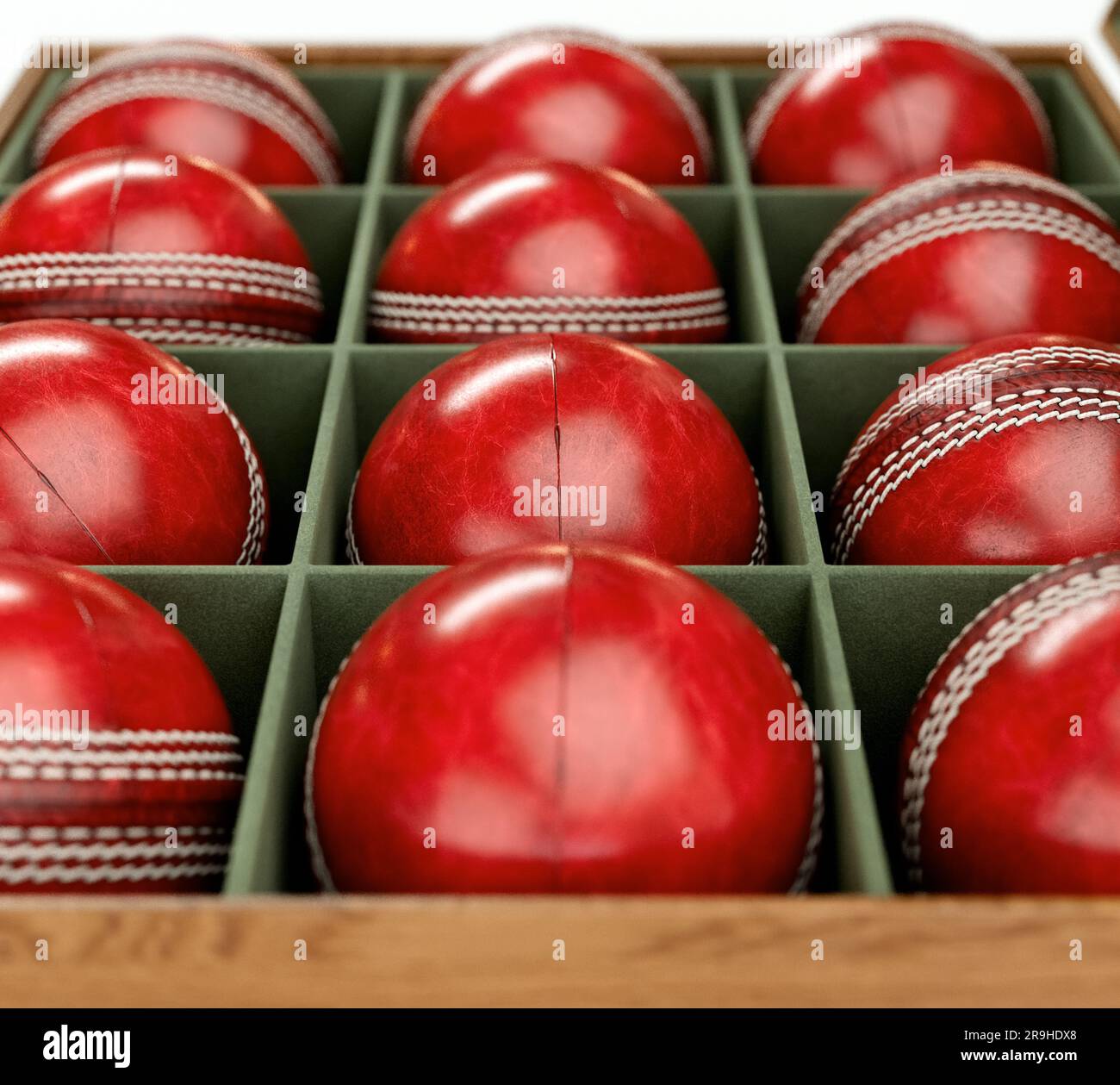 Twelve generic red cricket balls in a wooden display box lined with felt on an  isolated white background - 3D render Stock Photo