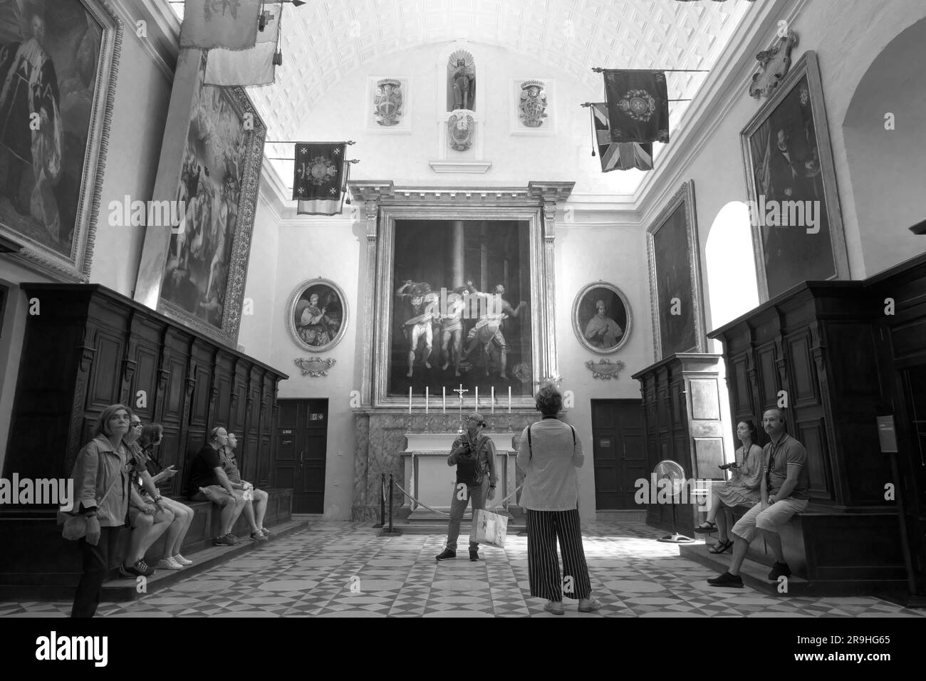 black and white tourists and interior of Sacristy in St. John's Co-Cathedral, Valletta, Malta Stock Photo