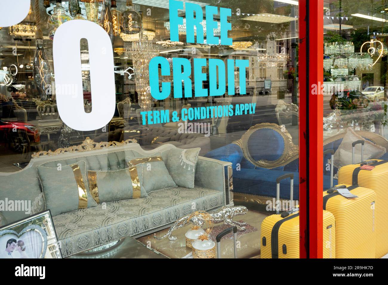 A furniture and home fixtures business advertises interest free credit in ts window in Ealing, on 26th June, in London, England. Stock Photo