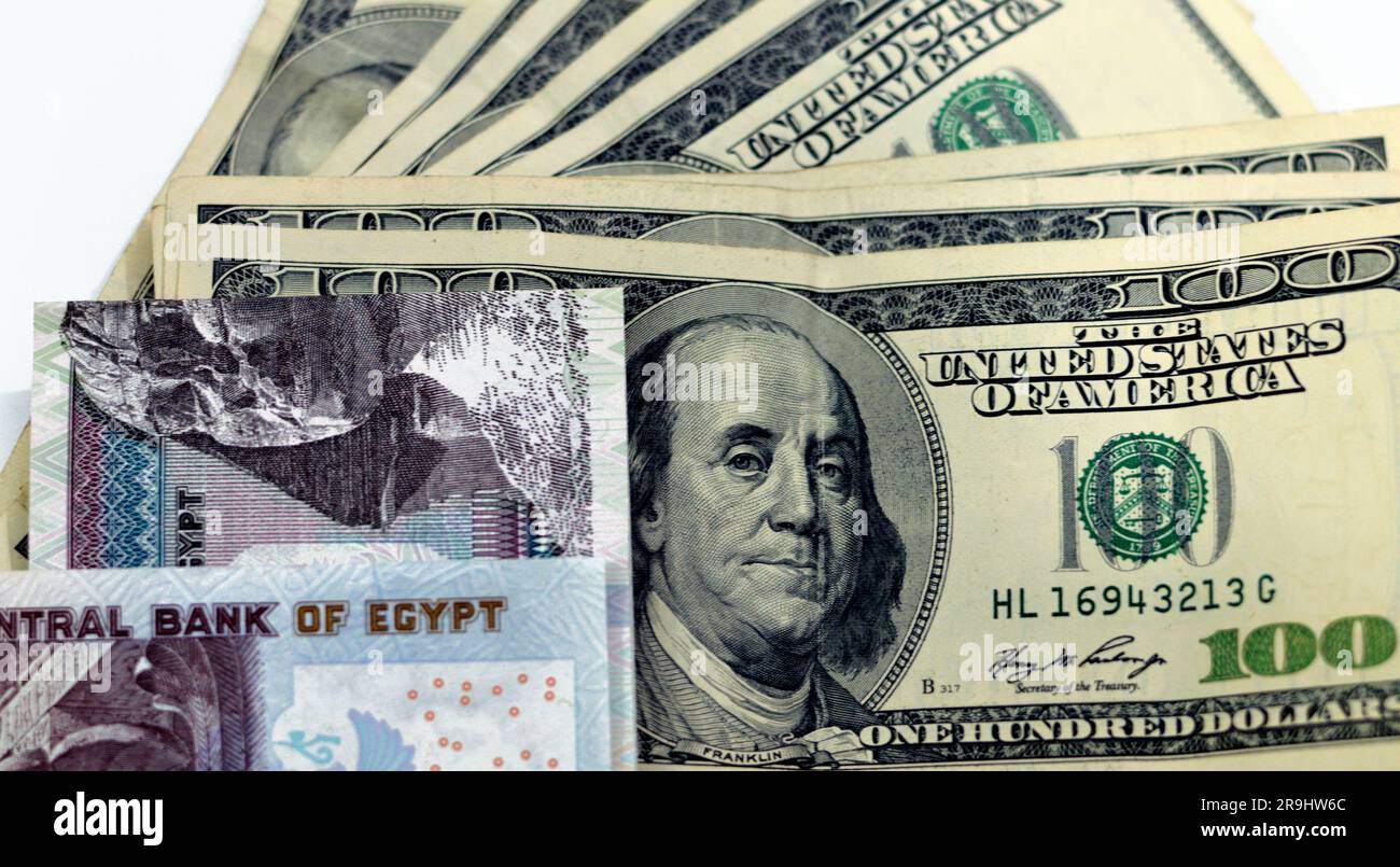 american-and-egyptian-money-banknotes-pile-of-old-vintage-retro-100-one-hundred-american-dollars-bill-with-stack-folded-egp-egyptian-pounds-le-mone-2R9HW6C.jpg