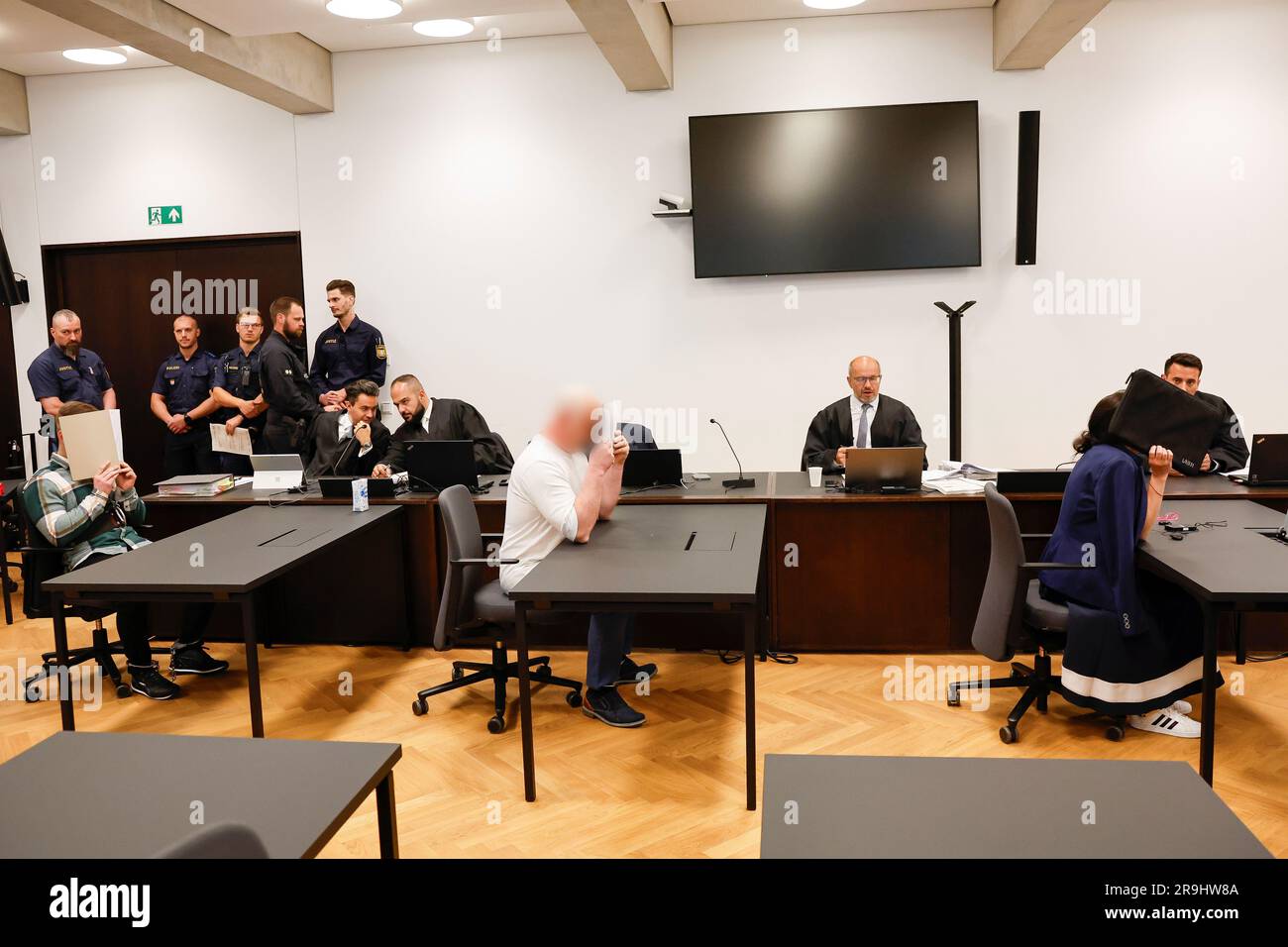 27 June 2023, Bavaria, Nuremberg: The three defendants sit in the ...