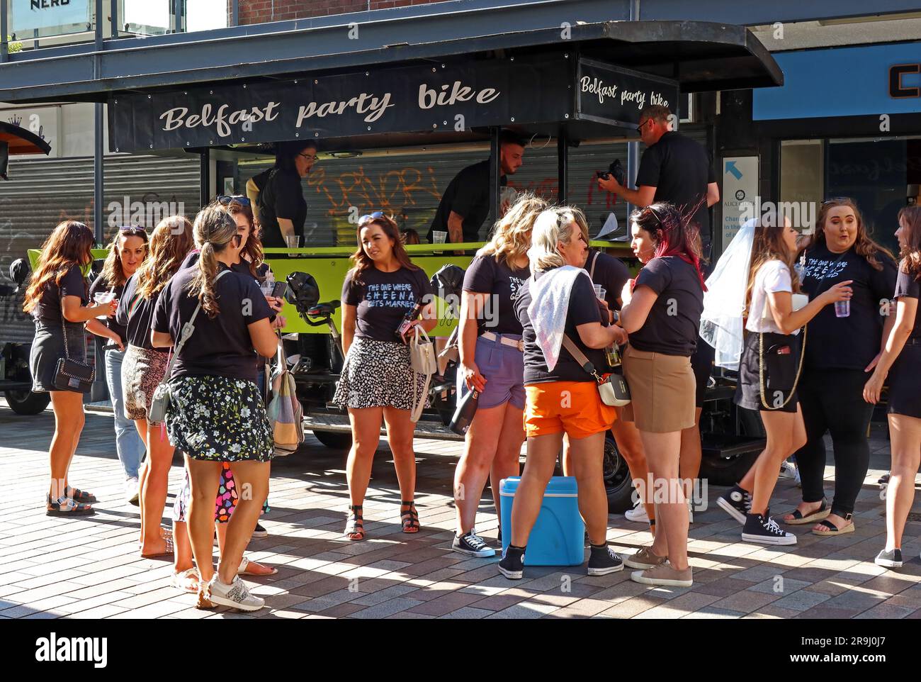 Hen Party of young women, boarding a Belfast party bike, in the city centre, Fountain St, - world of pain say PSNI Stock Photo