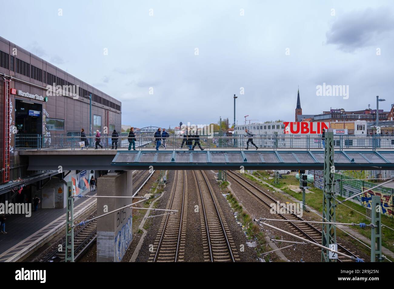 Berlin, Germany  - April 18, 2023 : View of a bridge leading to the Overground metro station Warschauer Strasse in Berlin Germany Stock Photo