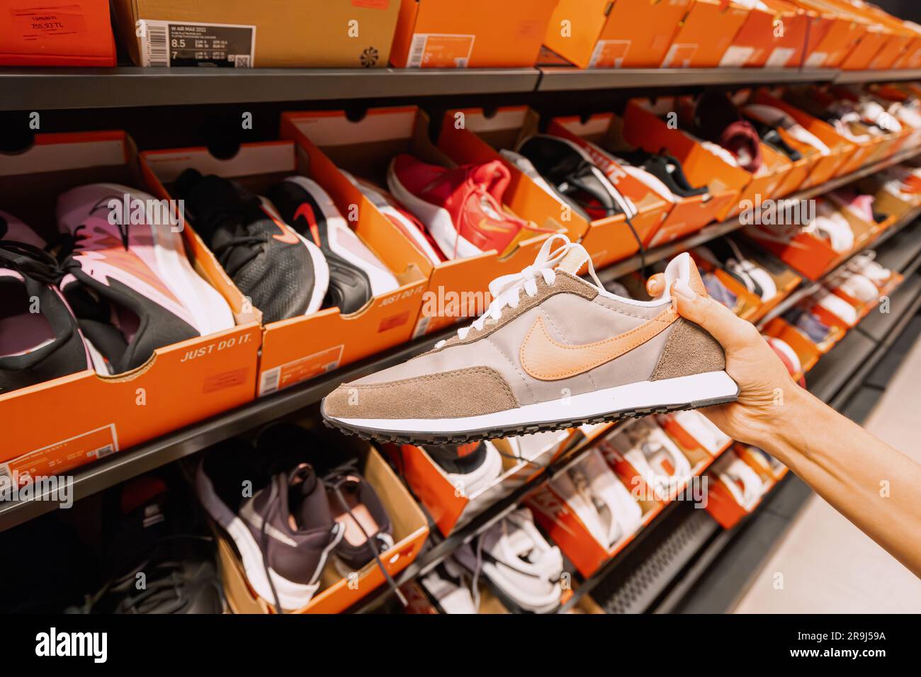 17 August 2022, Antalya, Turkey: Woman choosing sport shoes at nike store  Stock Photo - Alamy