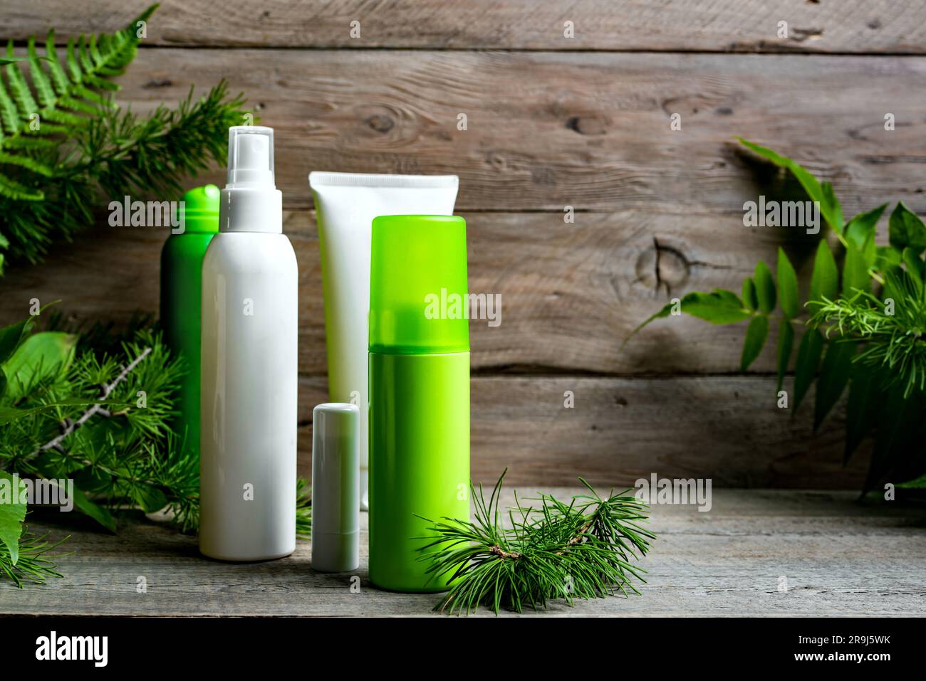 Mosquito repellents and sprays anti stinging insects on wooden