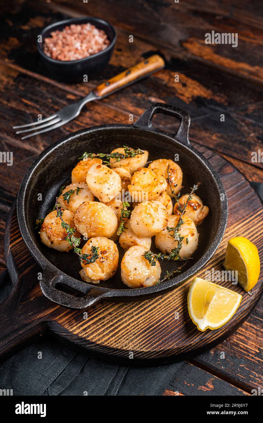 Scallops seared in garlic, thyme and butter served in cast iron skillet