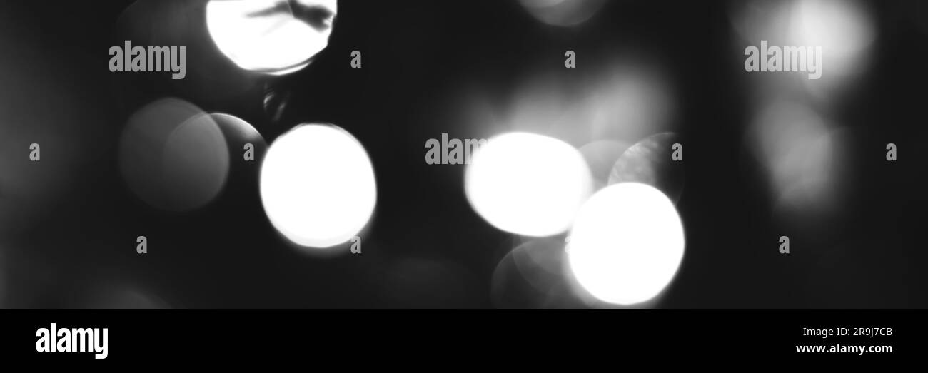 Blurred lights black and white background, banner texture. Abstract