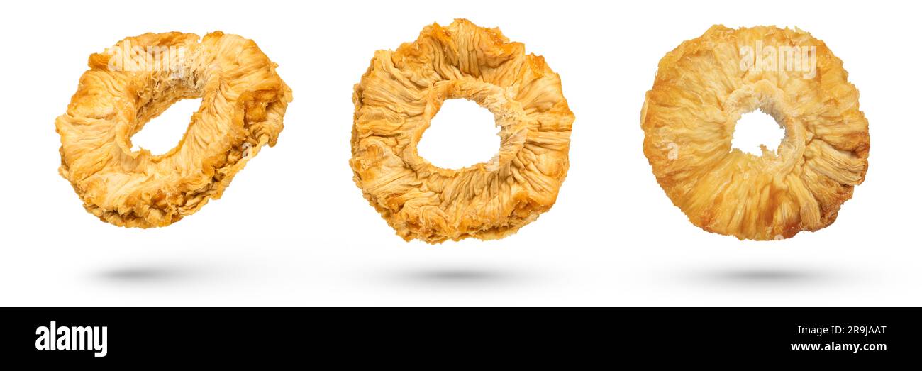 Dried pineapple slices on a white isolated background. Dried pineapples