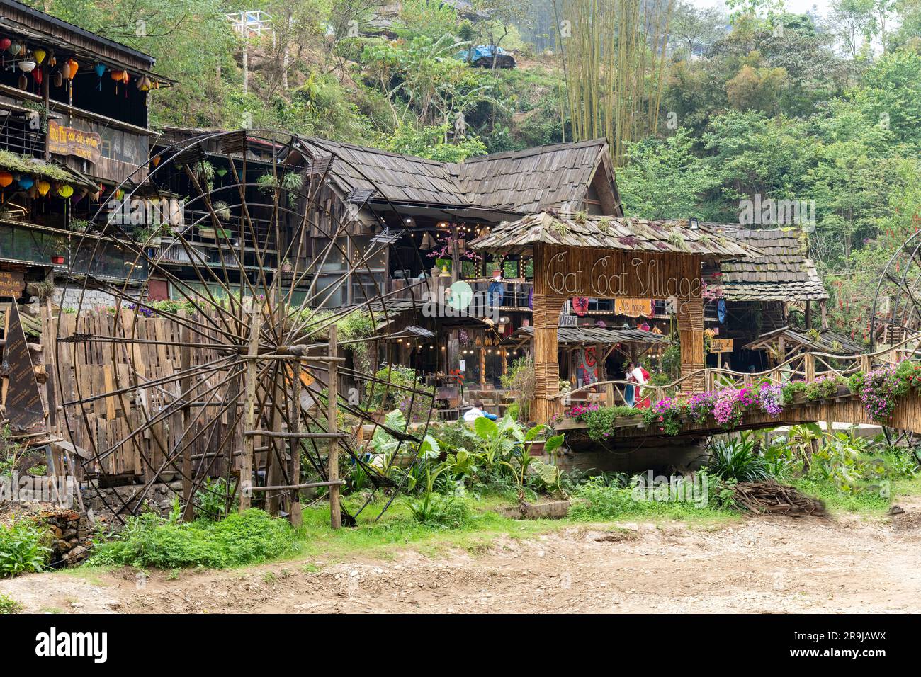 Cat Cat Village, Sapa, Vietnam-April 2023; One water wheel for power generation and made of bamboo and vines and some building in village know for its Stock Photo