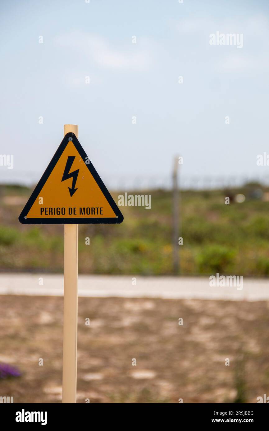 Electrical hazard sign, yellow triangle with a black lightning bolt