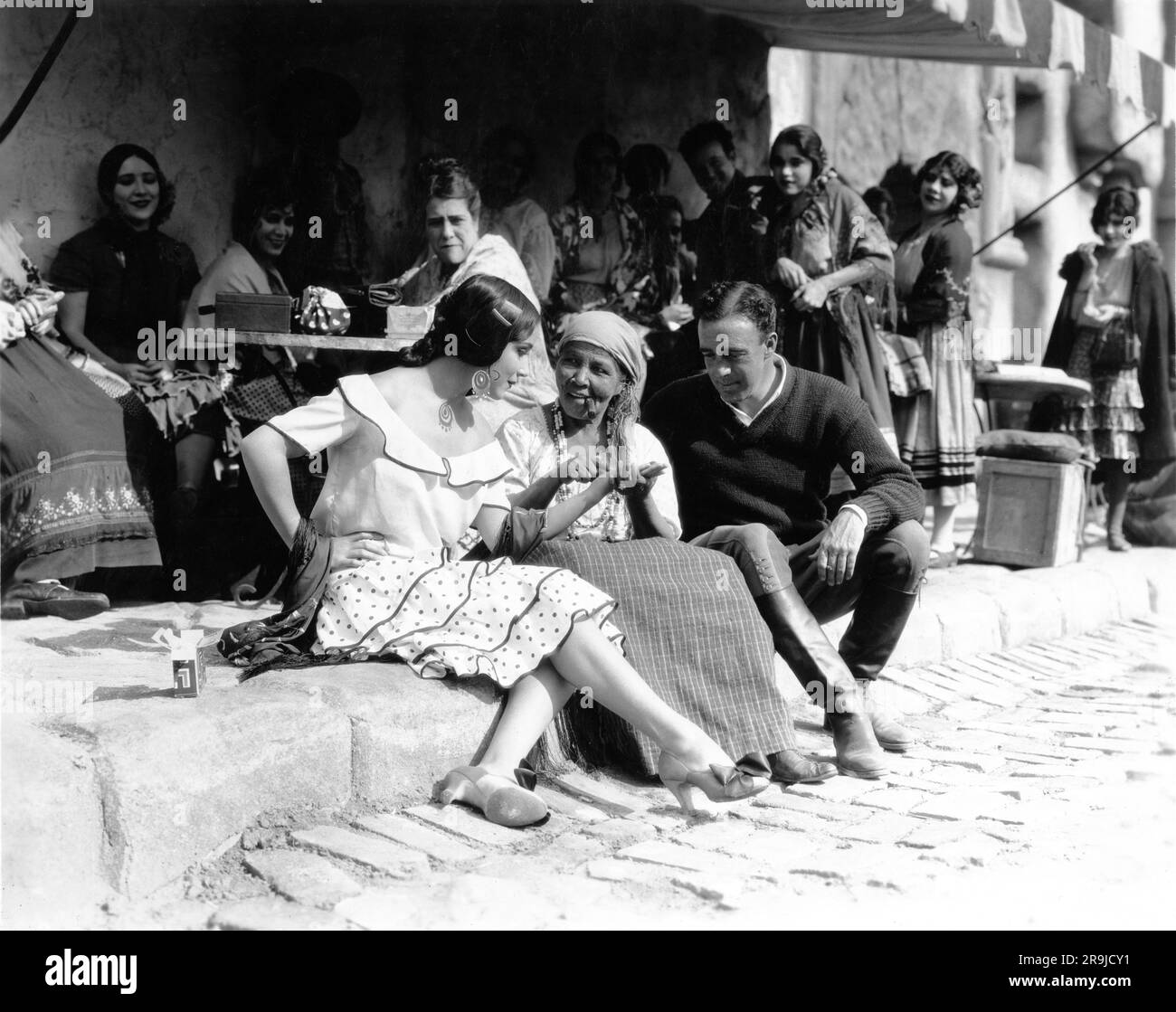 DOLORES DEL RIO and Director RAOUL WALSH on set candid during filming of  THE LOVES OF CARMEN 1927 director RAOUL WALSH novel Prosper Merimee Fox  Film Corporation Stock Photo - Alamy