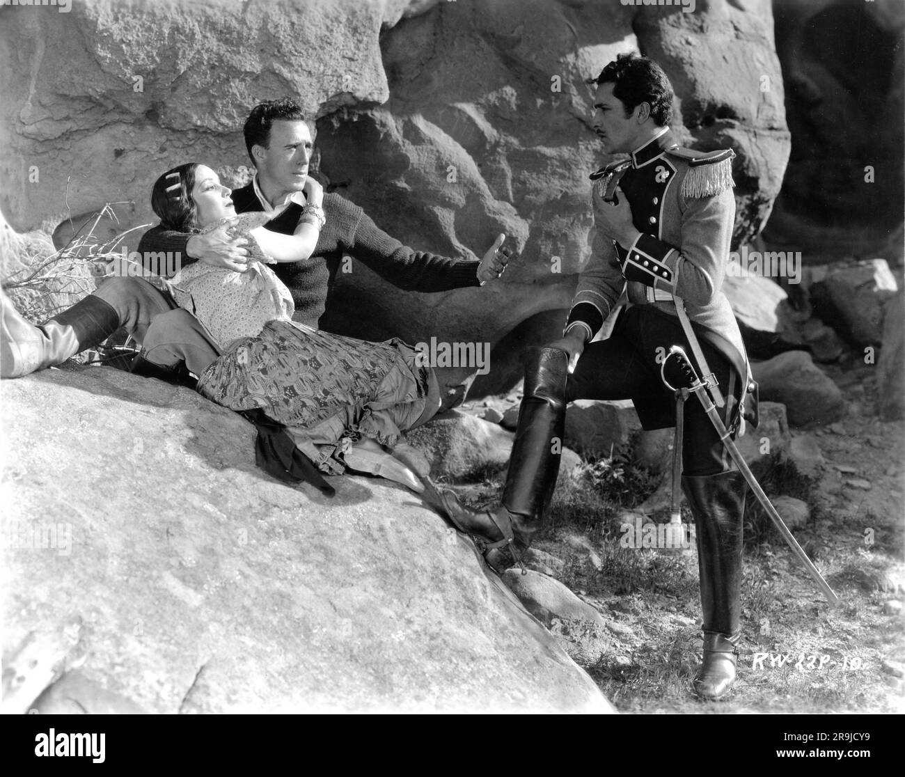 DOLORES DEL RIO Director RAOUL WALSH and DON ALVARADO on set location rehearsal candid during filming of THE LOVES OF CARMEN 1927 director RAOUL WALSH novel Prosper Merimee Fox Film Corporation Stock Photo