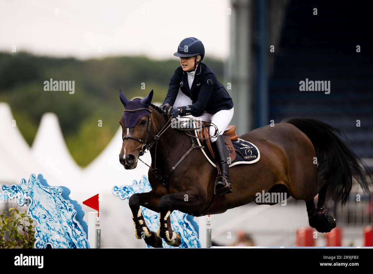 Aachen, Germany. 27th June, 2023. Equestrian sports, jumping: CHIO, Opening Jumping. Rider Evelina Tovek from Sweden on the horse 'Cortina' rides through the course. She won the competition. Credit: Rolf Vennenbernd/dpa/Alamy Live News Stock Photo