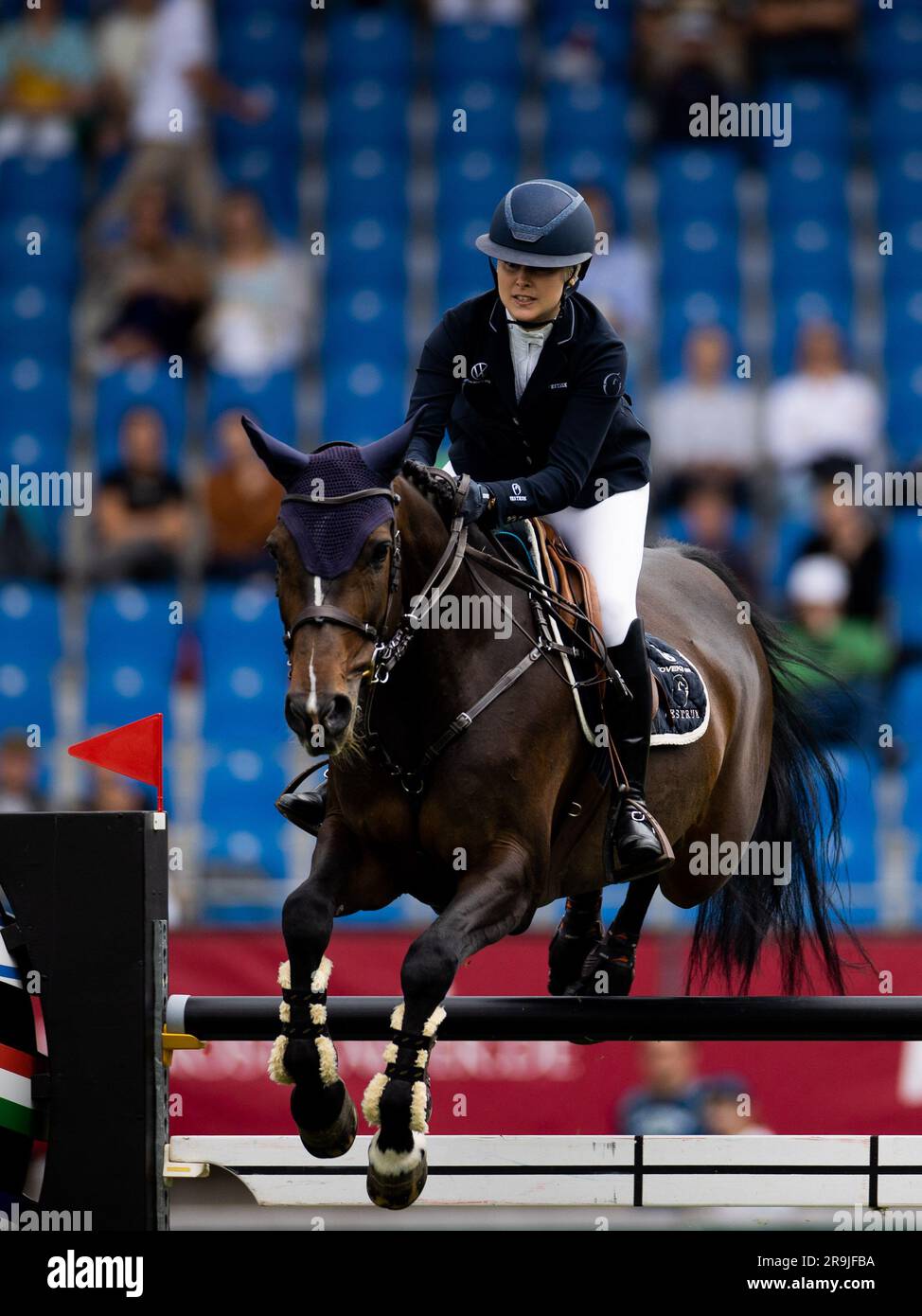 Aachen, Germany. 27th June, 2023. Equestrian sport, jumping: CHIO, Opening Jumping. Rider Evelina Tovek from Sweden on the horse 'Cortina' rides through the course. She won the competition. Credit: Rolf Vennenbernd/dpa/Alamy Live News Stock Photo