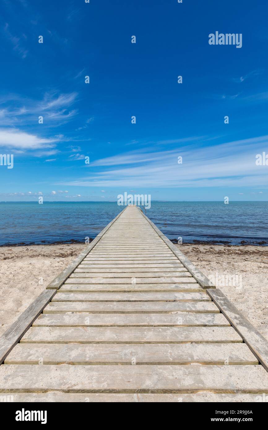 Wooden bathing pier into the Baltic Sea at Købingsmark on the island of Als, Denmark Stock Photo