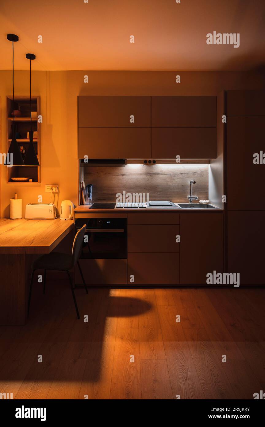 Interior design of minimalist kitchen integrated with dining area with