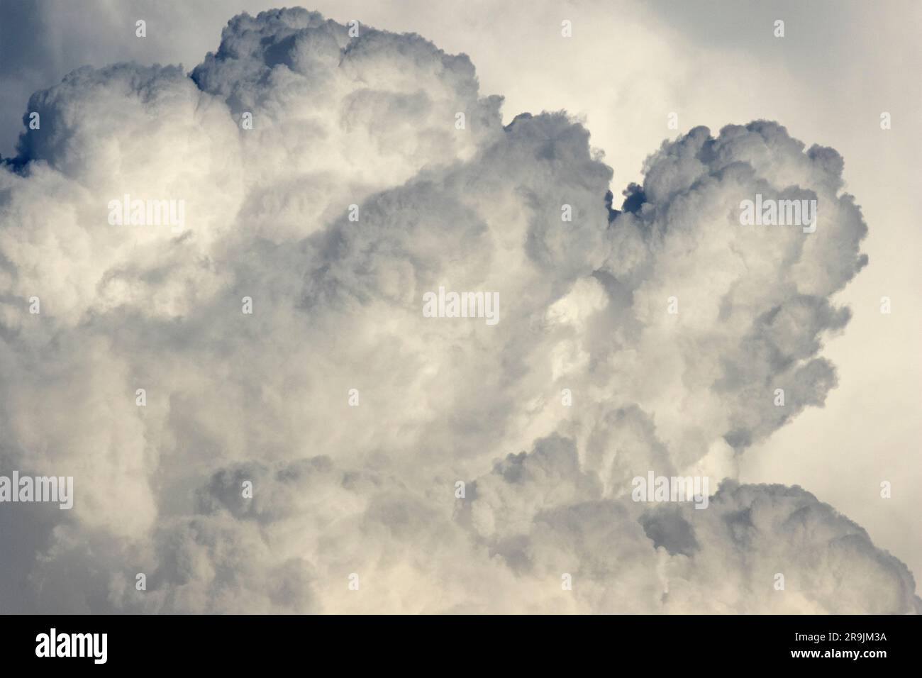 The soft and fluffy appearance of a Cumulonimbus cloud is deceptive. the forces raging withing these colossal structures are violent and destructive. Stock Photo