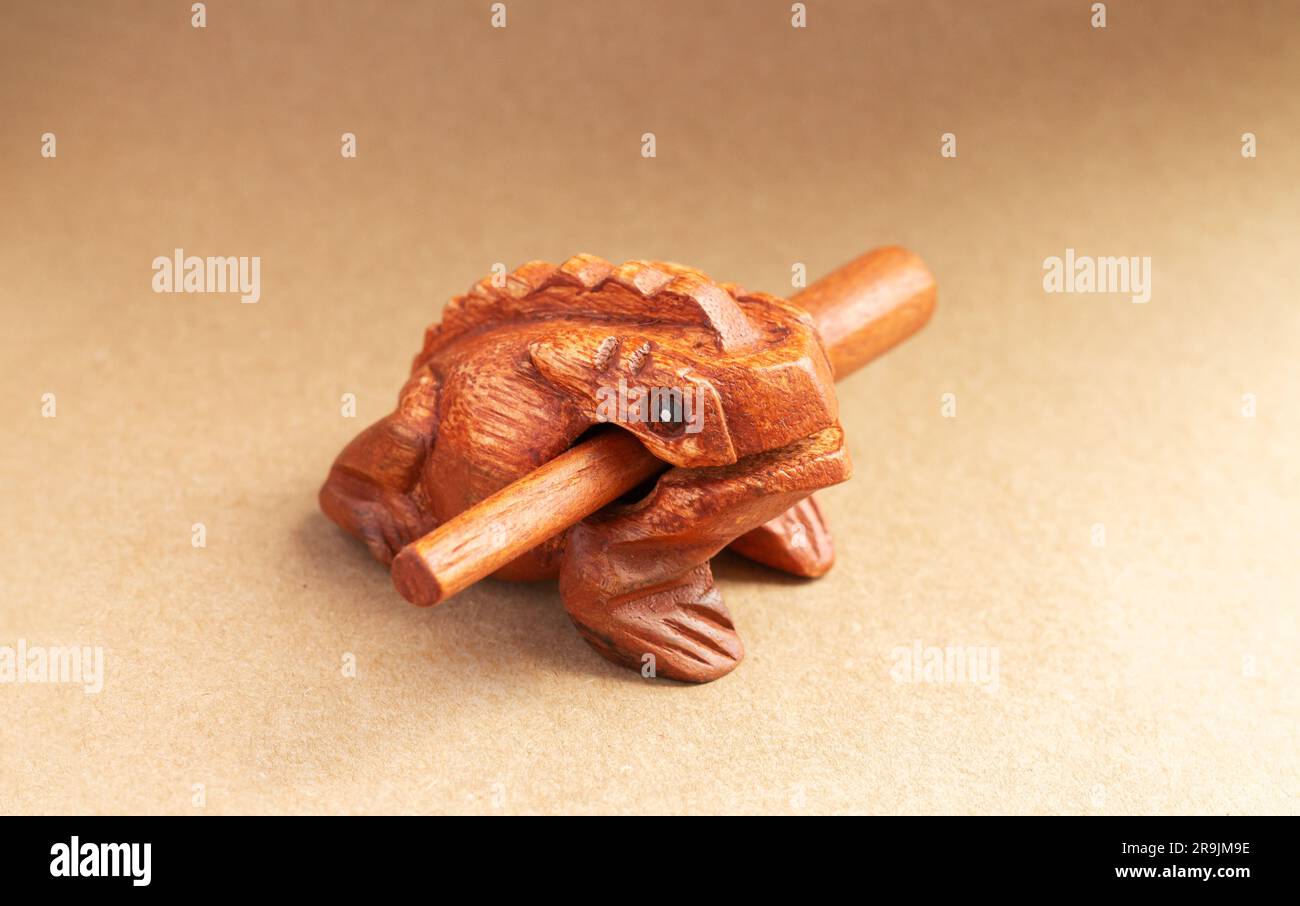 Wooden Guiro Frog - percussion music instrument or kids sound toy Stock Photo