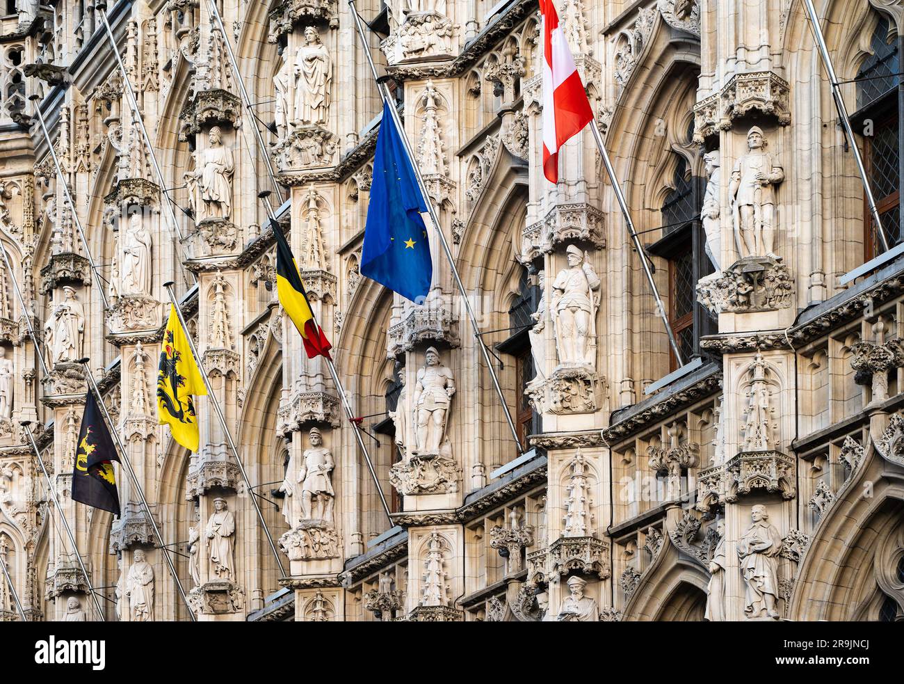 Leuven, Flemish Brabant, Belgium, July 23, 2023 - Decorated facade of the city hall with flags from left to right of Flemish Brabant, Flanders, Belgiu Stock Photo