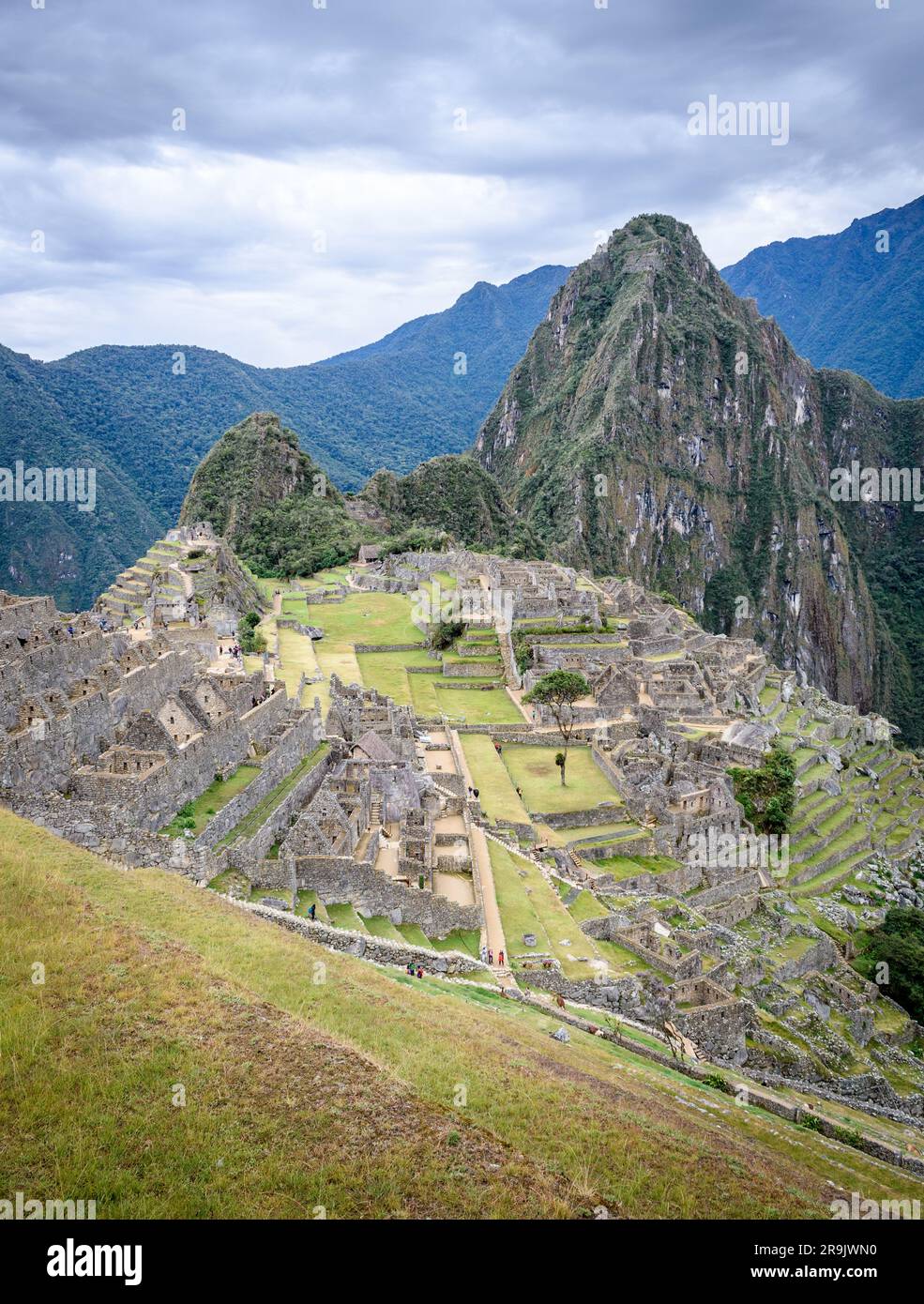 The path to Machu Picchu, the high mountain capital of the Inca tribe, a 15th century citadel site, buildings and view of the plateau and Andes mounta Stock Photo