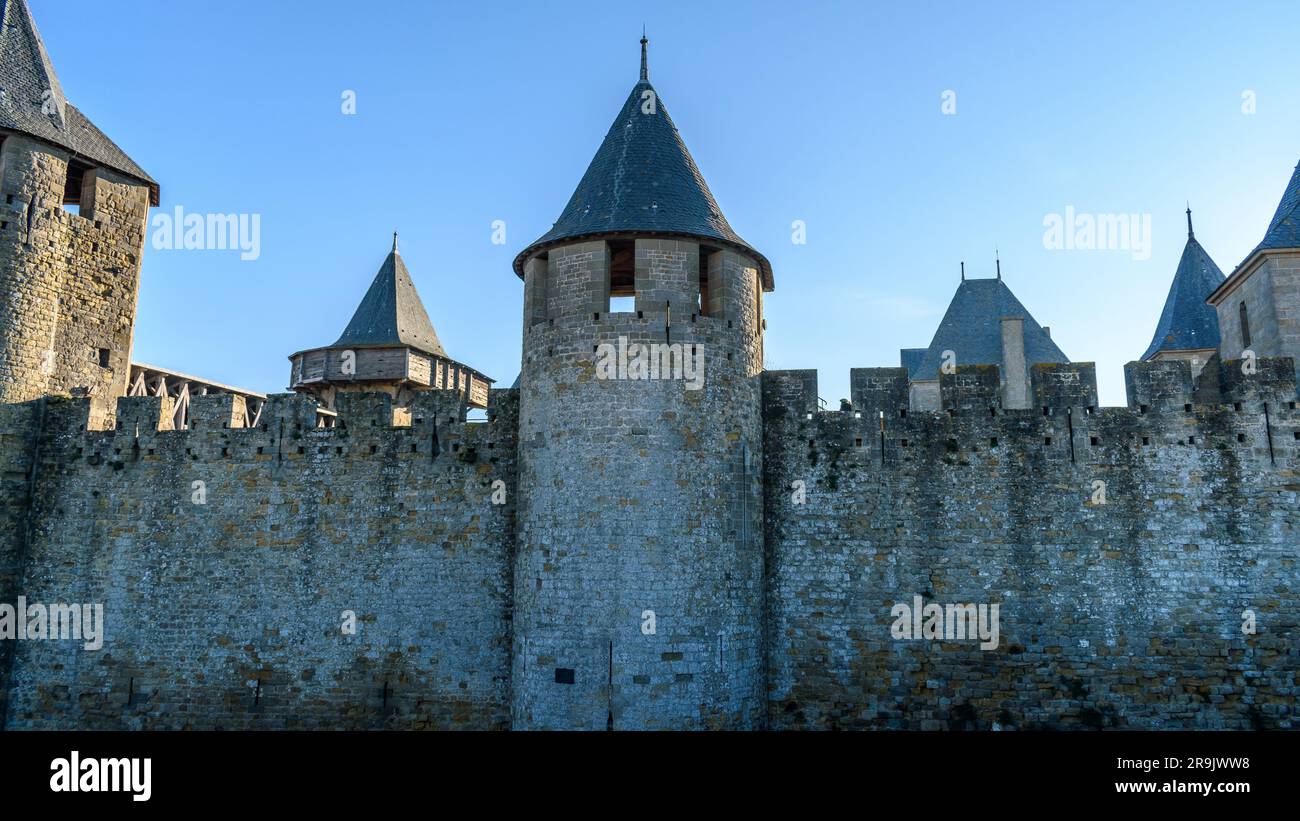 The Château Comtal, Count’s Castle, is a medieval castle in the Cité of Carcassonne, tall towers and wall. Stock Photo