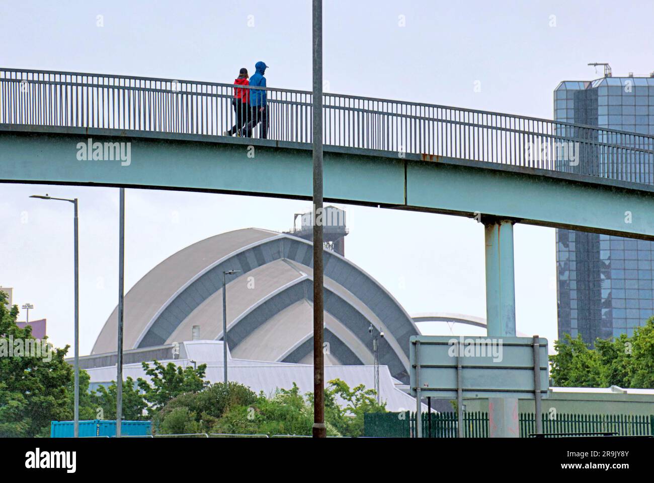 Glasgow, Scotland, UK 27th June, 2023. UK Weather:  Wet in the city as tourists and locals suffer in the rain. The clydeside expressway in the wet with the armadillo and the crown plaza. Credit Gerard Ferry/Alamy Live News Stock Photo