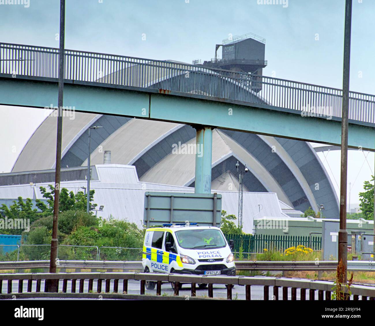Glasgow, Scotland, UK 27th June, 2023. UK Weather:  Wet in the city as tourists and locals suffer in the rain. The clydeside expressway in the wet with the armadillo and the crown plaza. Credit Gerard Ferry/Alamy Live News Stock Photo