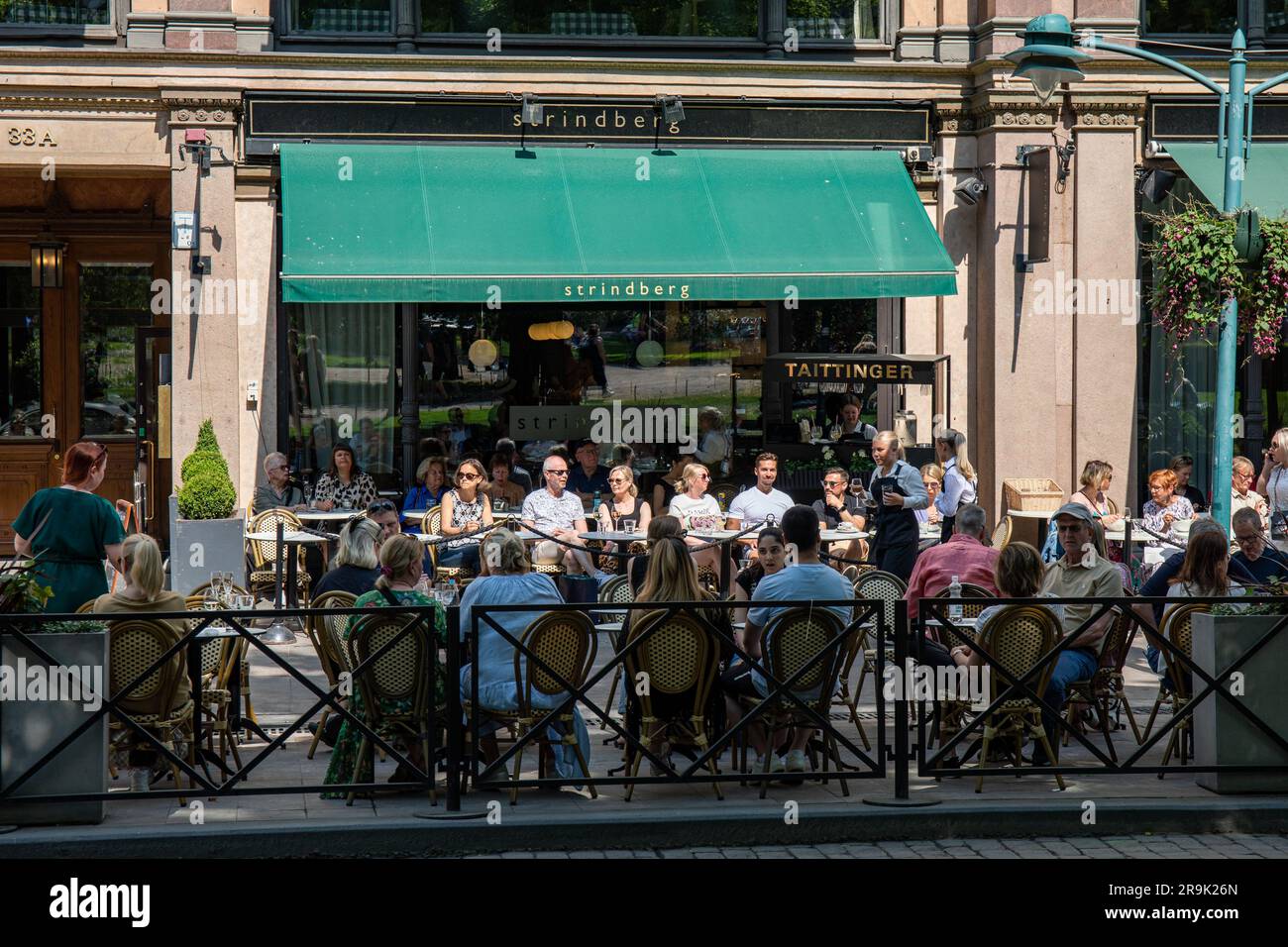 Cafe Strindberg outdoor seating with customers at Pohjoisesplanadi in Helsinki, Finland Stock Photo