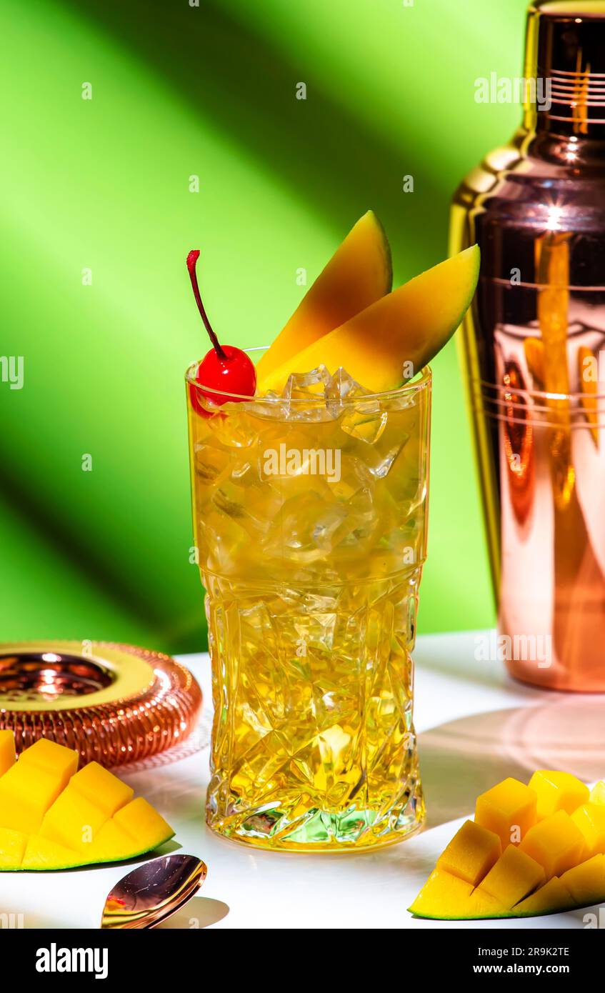 Mango rum collins alcoholic cocktail with rum, syrup, ginger beer