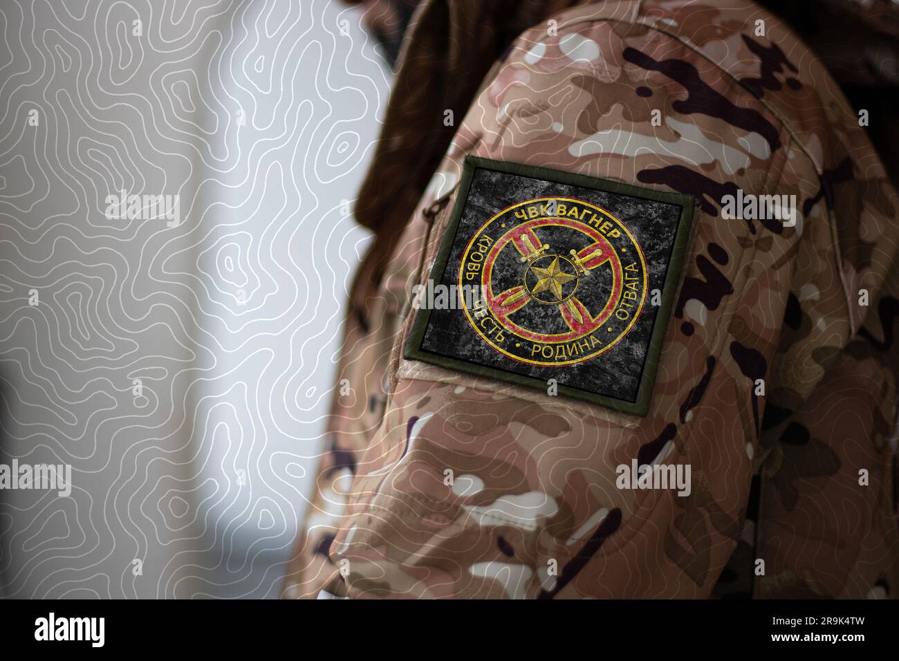 Wagner Group Soldier. Soldier with flag Wagner Private Military Company,  PMC Wagner flag on a military uniform. Camouflage clothing Stock Photo -  Alamy