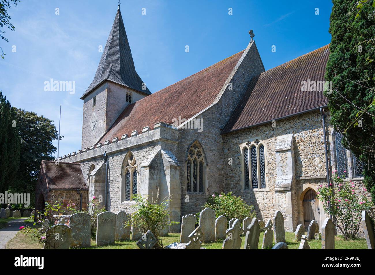 Exterior of Holy Trinity Church, a Grade l listed Anglican church. Some parts of the building date from Saxon times. Bosham, West Sussex, England, UK Stock Photo
