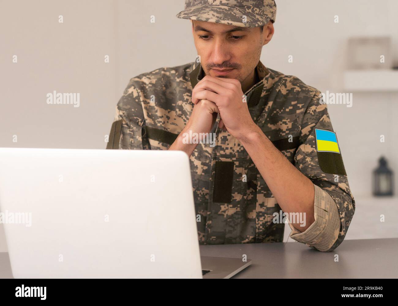 Ukrainian military man with a laptop Stock Photo - Alamy