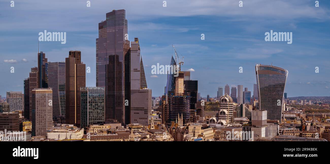 Panoramic aerial city scape about London city with skyscapers. Amazing sunny day with a bit cloudy sky. Stock Photo