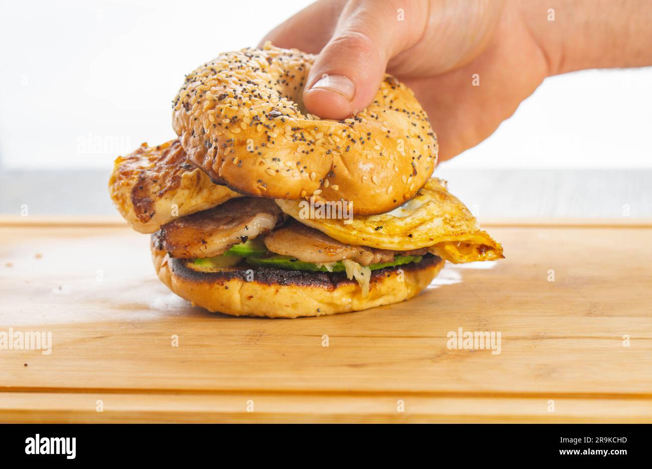 Breakfast sandwich pork bacon avocado and egg isolated studio shot copy