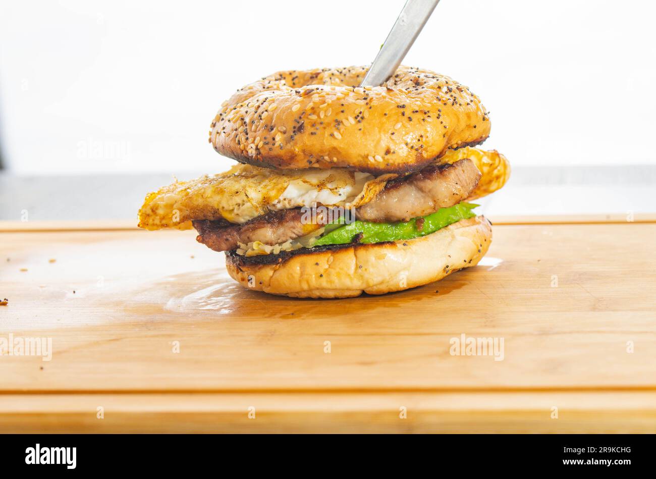 Breakfast sandwich pork bacon avocado and egg isolated studio shot copy