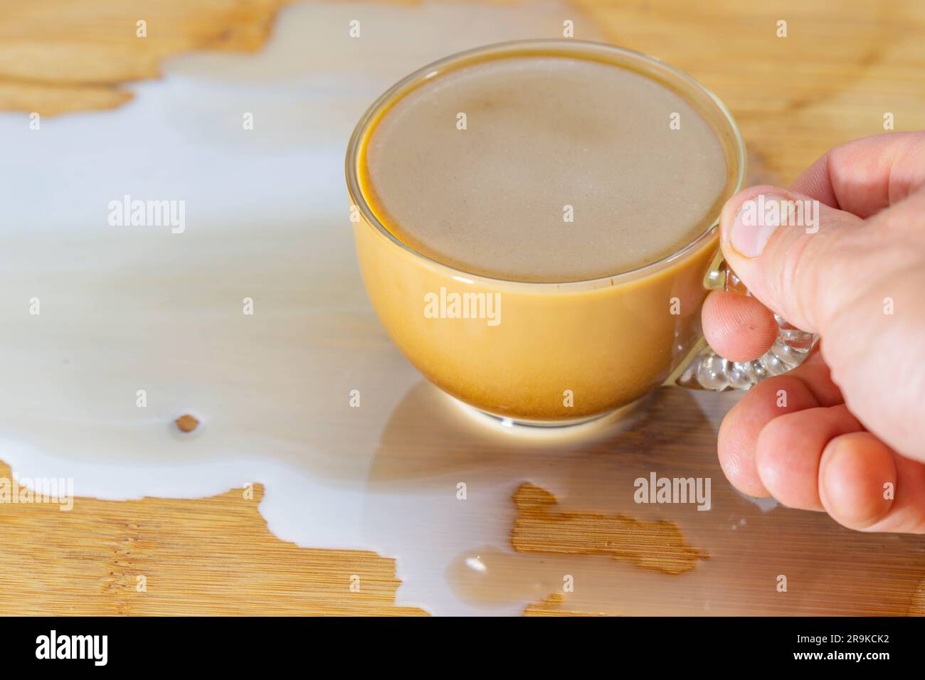 Coffee with cream spilled milk disaster concept Stock Photo