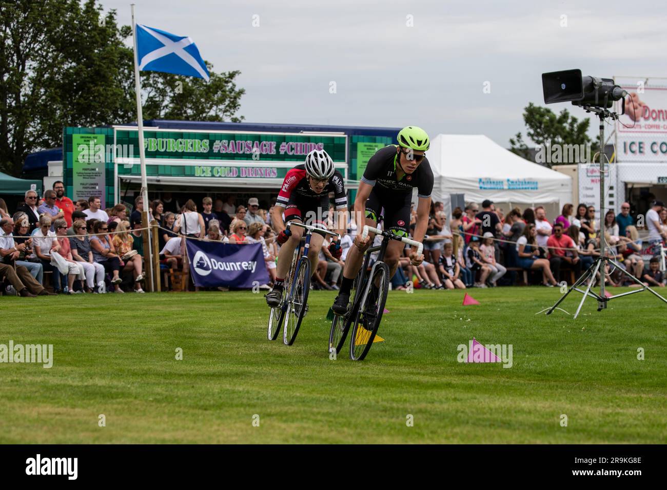 Elite cyclists compete in the annual Halkirk Highland games circuit race in Caithness, Scotland to secure the prestigious prize of fastest rider. Stock Photo