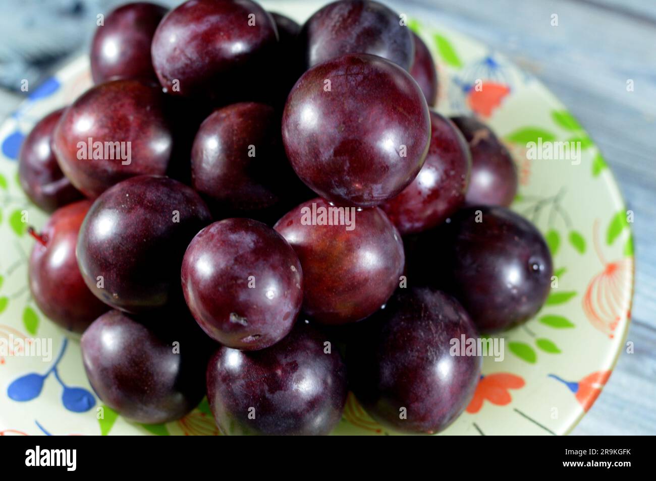 pile of plum fruit, A fruit of some species in Prunus subg. Prunus