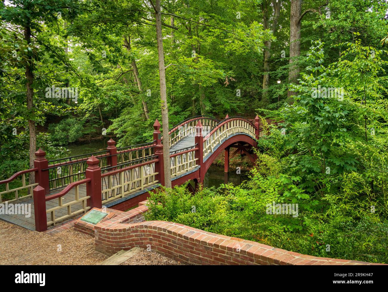 Ornate wooden bridge over Crim Dell on campus of William and Mary college in Williamsburg Virginia Stock Photo